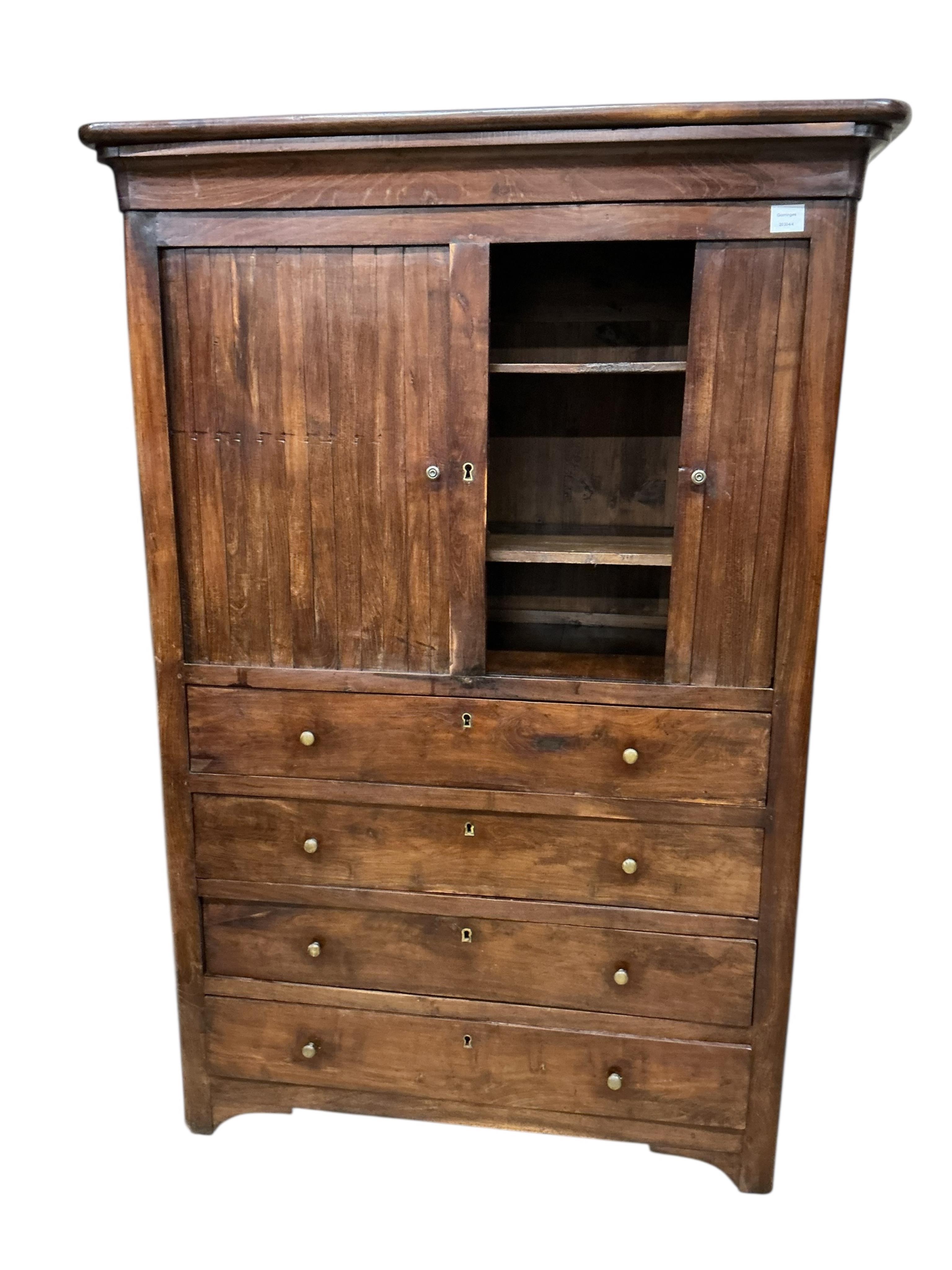 A cabinet, the upper section with twin tambour doors, enclosing a shelved interior, above the lower section with four long drawers, width 108cm, depth 45cm, height 158cm